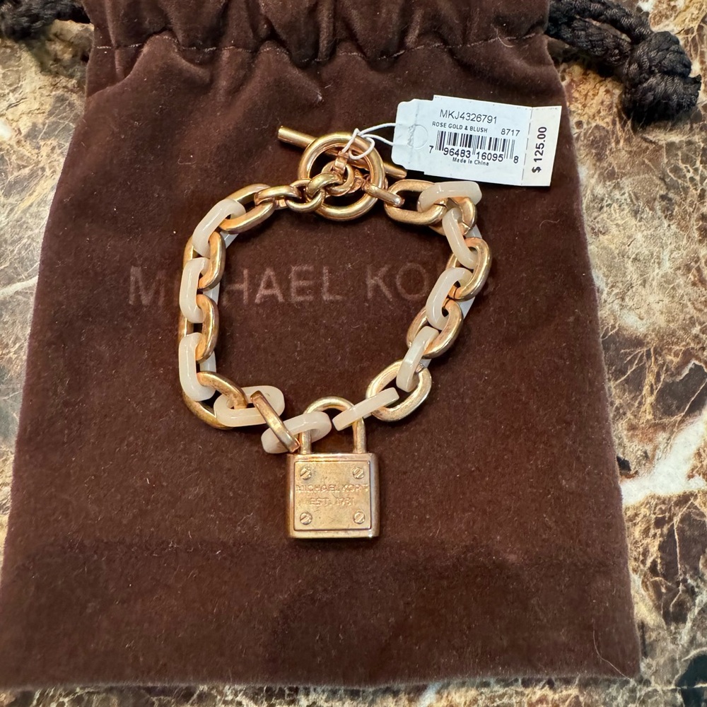 Michael Kors bracelet. Brand new with tag. Comes with pouch